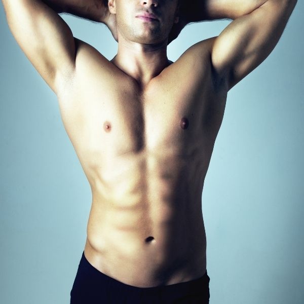 Man poses after FTM liposculpture